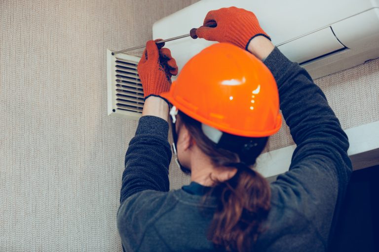 Technician repairing the AC