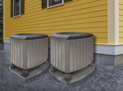 Two grey-colored AC units were installed in the backyard of a house in Annapolis, MD