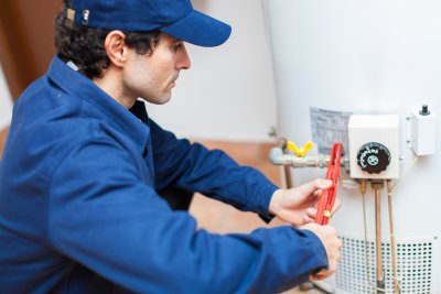 Technician repairing heating system