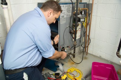 Technician working on the HVAC system