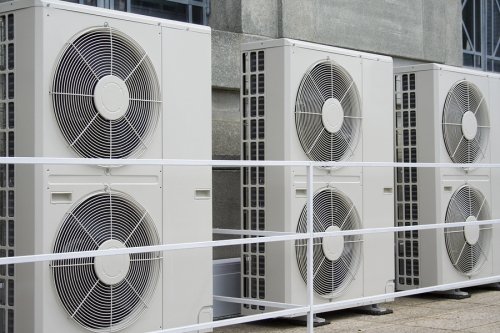 Six air conditioning units outside the commercial area