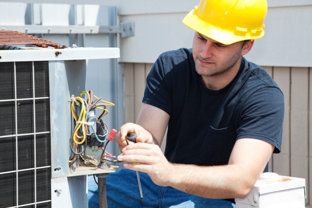 Technician repairing the air conditioner