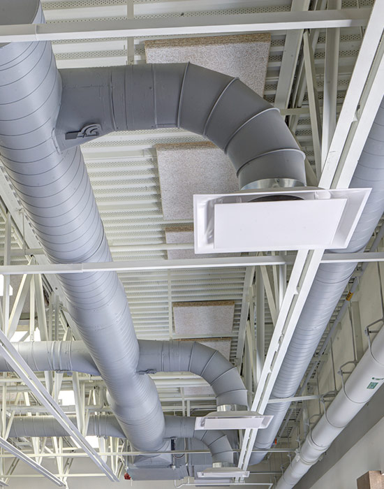 Exposed modern heating and cooling ductwork in the ceiling in Annapolis, MD
