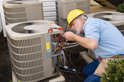 Technician working on the compressor