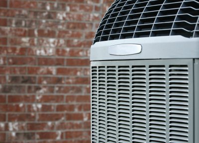 Close-up of an AC unit installed in the backyard of a house in Annapolis, MD