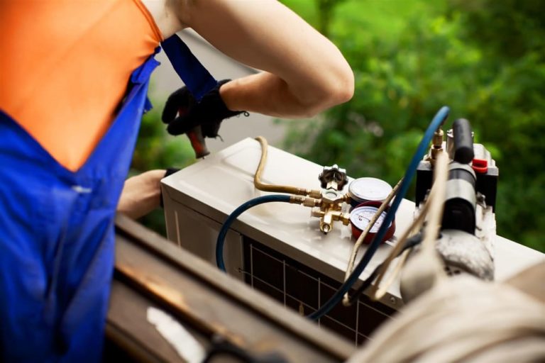 Technician repairing the AC