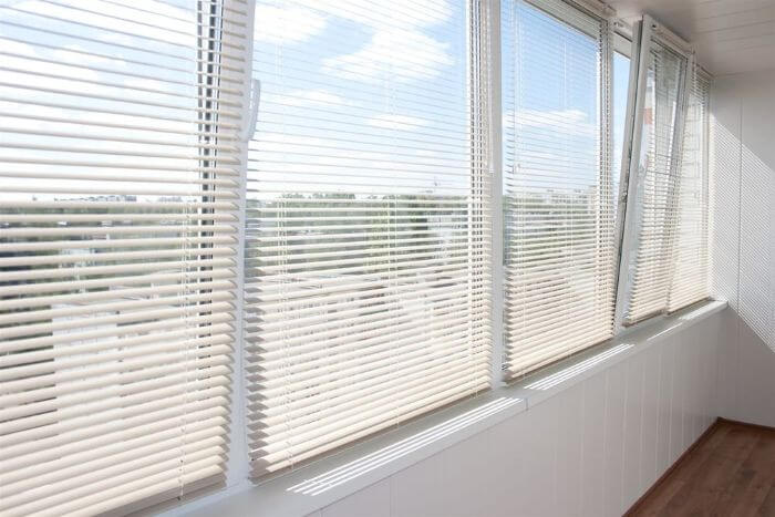 Window with white shade at the home